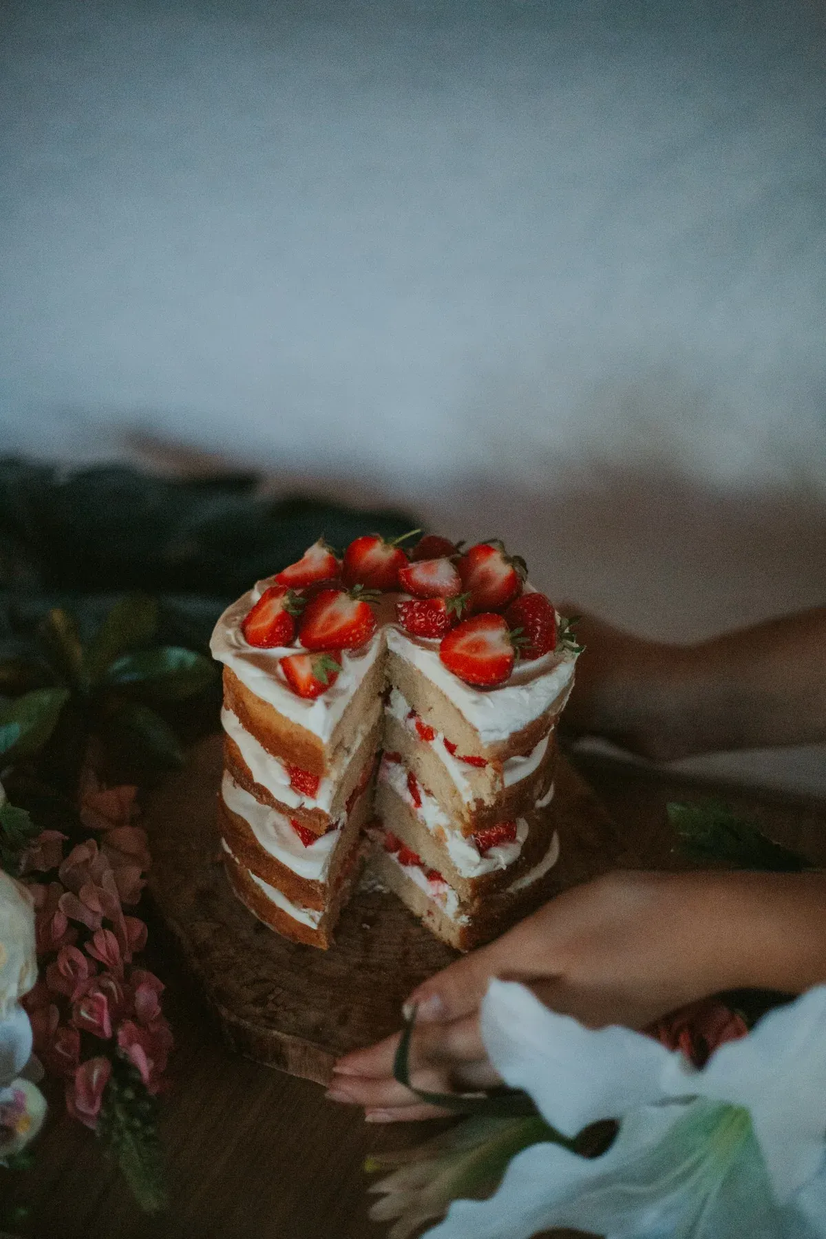 Vanilla layer cake filled with cream and strawberries